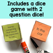 Two dice boxes with text and a marker on a white background