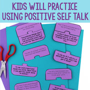 Purple speech bubble cards with positive affirmations on a blue background with scissors.