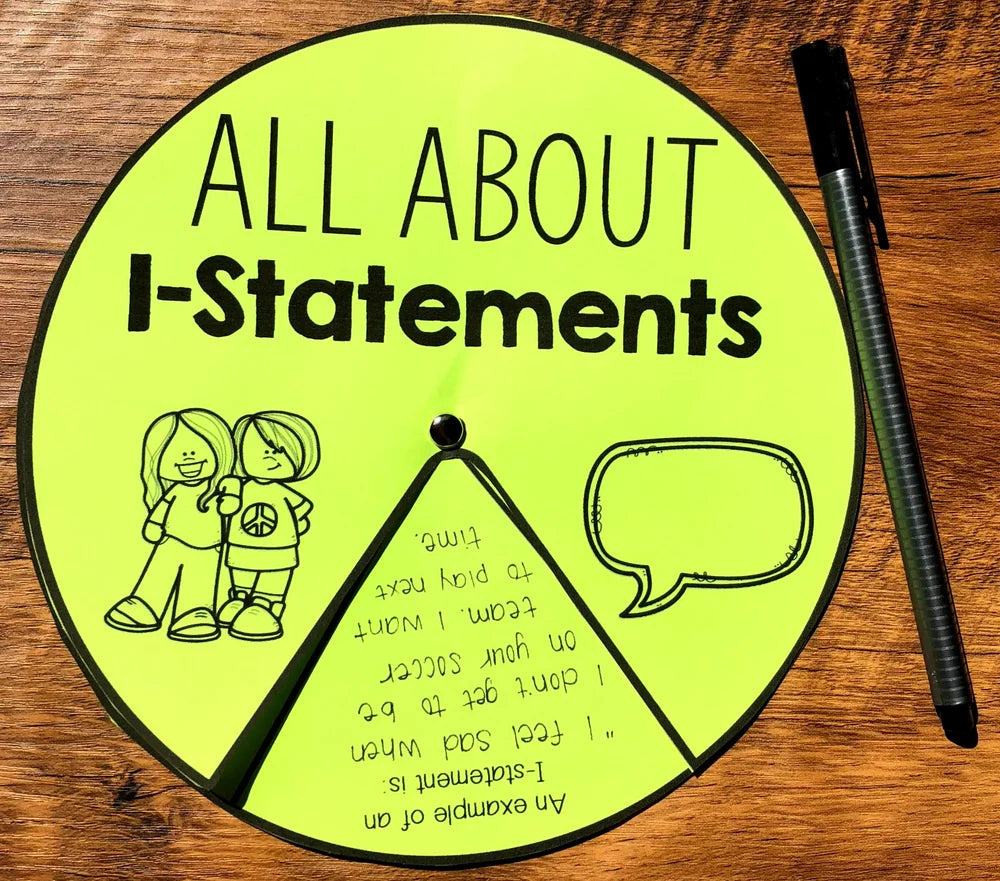 Educational material on I-statements with a pen on a wooden surface