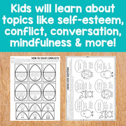 Educational worksheets on a wooden surface with text about learning topics like self-esteem, conflict, conversation, mindfulness, and more.