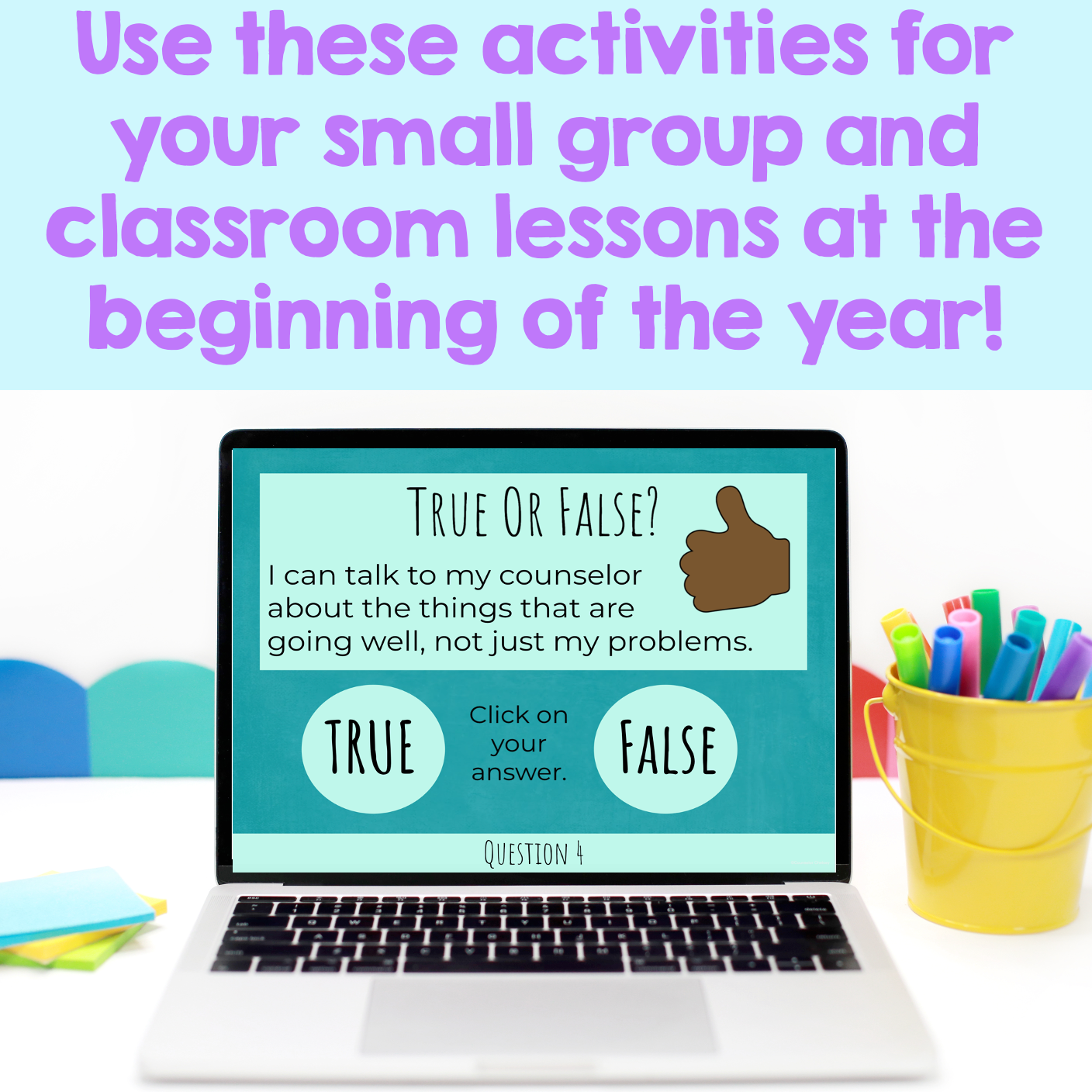 Laptop displaying a True or False educational game with a colorful background and stationery items.