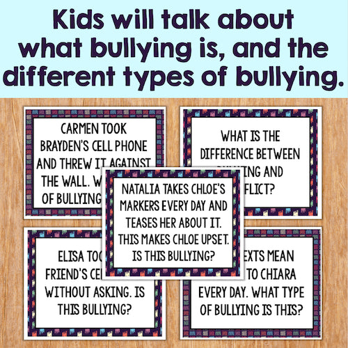 Educational posters on bullying with text examples on a wooden surface.
