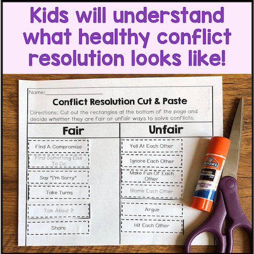 Conflict resolution worksheet with scissors and glue stick on a wooden surface