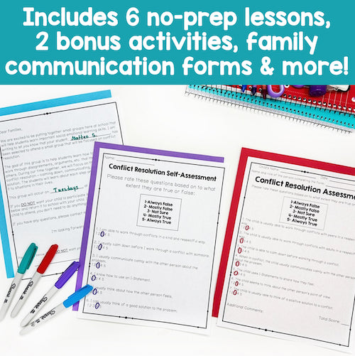 Educational materials with worksheets and markers on a white background