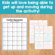 Conflict Resolution Scoot Game on a wooden surface with text about kids loving movement during activities.