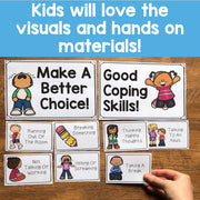 Educational cards on a wooden surface with text about coping skills and visuals.