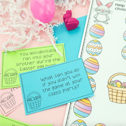 Educational cards with Easter-themed questions on a pink surface with Easter decorations.