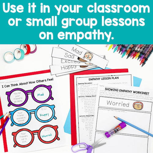 Educational materials for empathy lessons with worksheets and coloring supplies on a blue background.