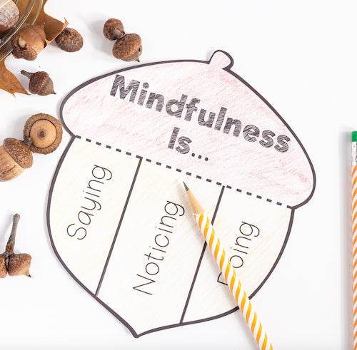 Mindfulness activity sheet shaped like an acorn with acorns and a pencil on a white background