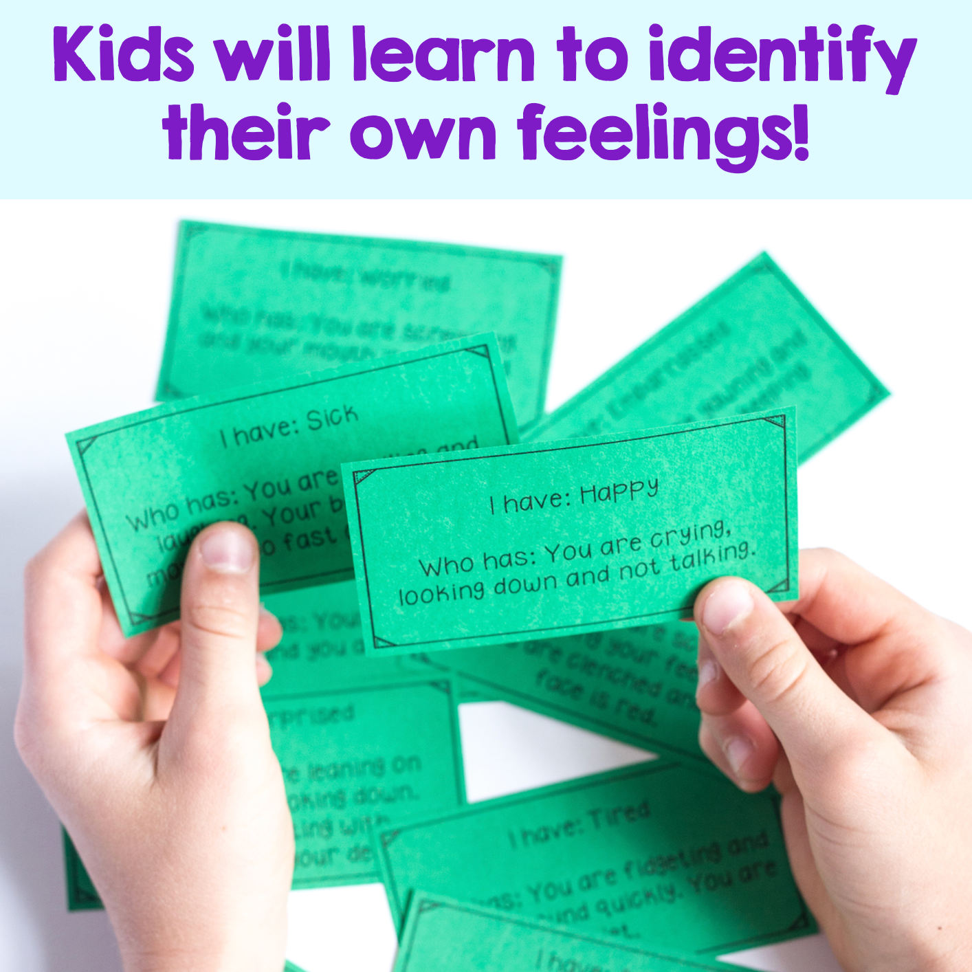 Green cards with text held by hands on a white background, promoting emotional awareness.