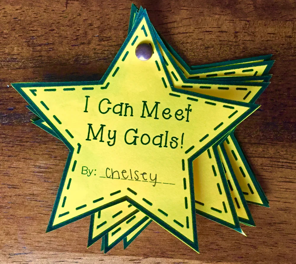 Star-shaped yellow tag with green border and text on a wooden surface