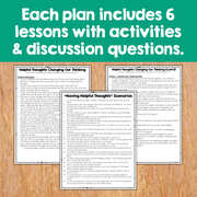 Educational materials with text about lesson plans and activities on a wooden surface.