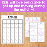 Kindness Scoot Game with answer cards on a wooden surface