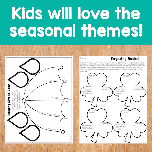 Educational materials with heart shapes and text on a wooden surface