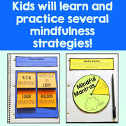 Educational materials for mindfulness strategies with colorful cards and a notebook on a blue background.
