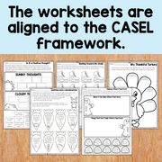 Educational worksheets on a wooden surface with text indicating alignment to the CASEL framework.