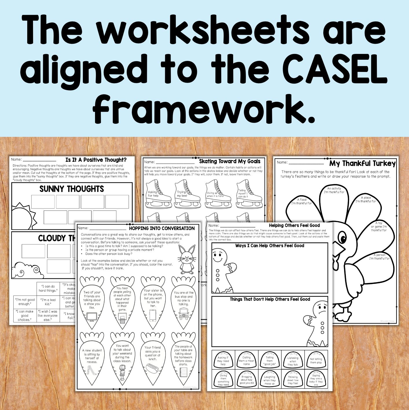 Educational worksheets on a wooden surface with text indicating alignment to the CASEL framework.