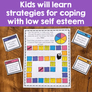 Educational game board and cards for coping with low self-esteem on a wooden surface.