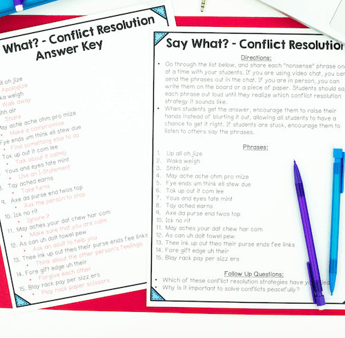 Conflict resolution worksheet with answer key and pens on a white background
