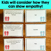 Educational cards on a wooden surface with scenarios and emotion labels for empathy practice.
