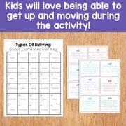 Educational materials on types of bullying with answer key on a wooden surface